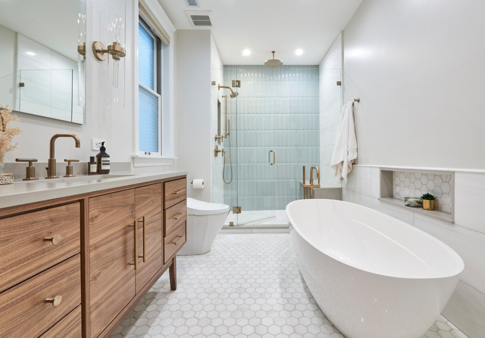 Inspiration for a medium sized traditional ensuite bathroom in Chicago with flat-panel cabinets, medium wood cabinets, a freestanding bath, an alcove shower, white tiles, porcelain tiles, white walls, porcelain flooring, a submerged sink, quartz worktops, white floors, a hinged door, white worktops, a shower bench, double sinks and a freestanding vanity unit.