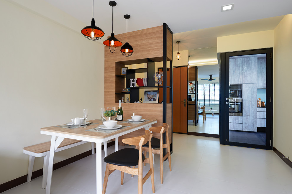 This is an example of a scandinavian dining room in Singapore with beige walls, ceramic floors and no fireplace.