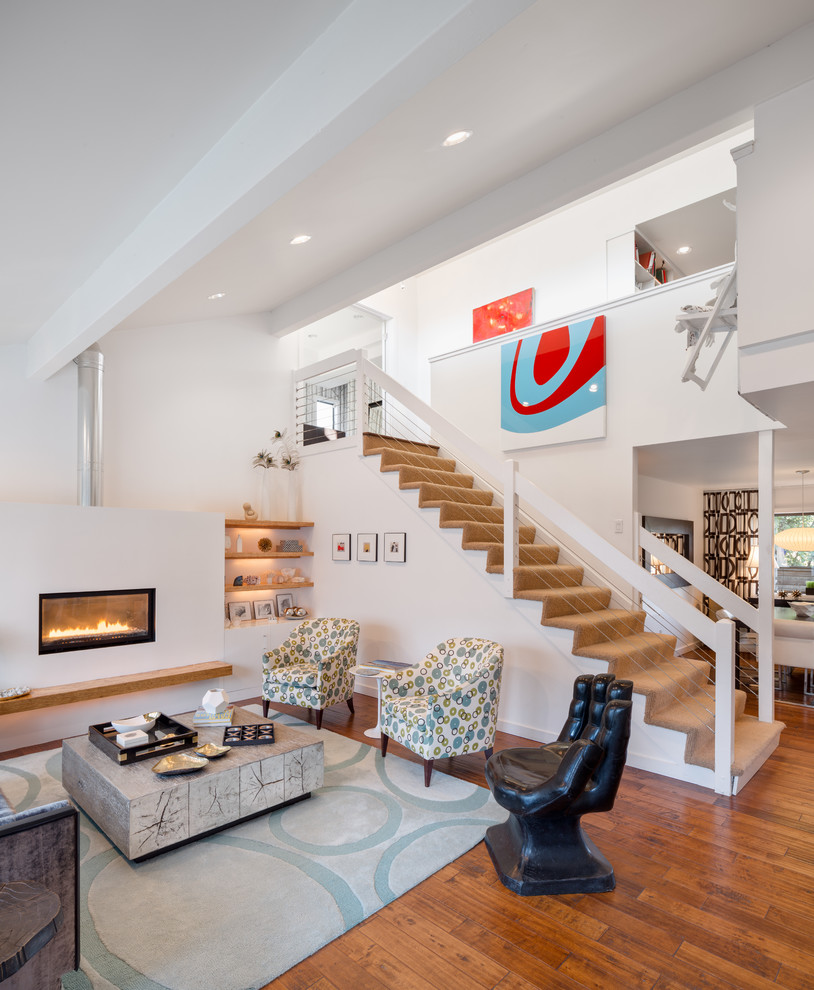 Trendy living room photo in Portland with white walls and a ribbon fireplace