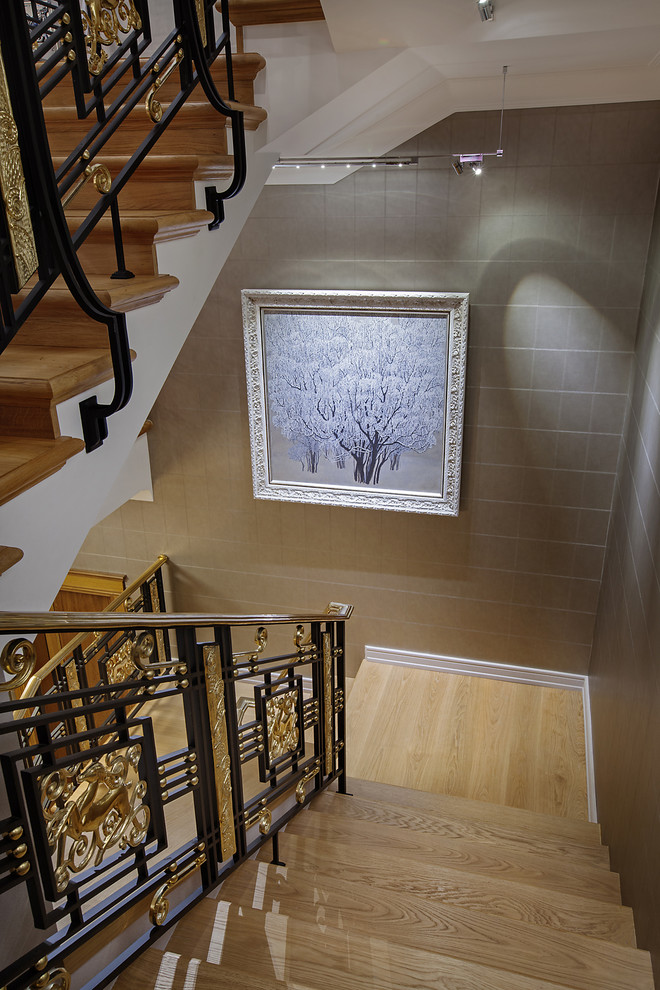Inspiration for a mid-sized traditional wood u-shaped staircase in Moscow with wood risers.
