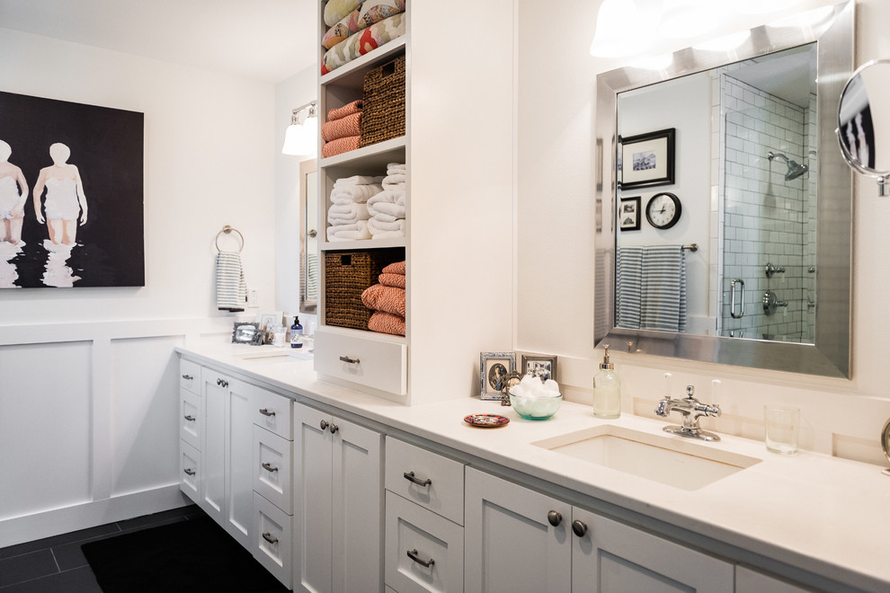 This is an example of a large transitional master bathroom in Austin with recessed-panel cabinets, white cabinets, a claw-foot tub, an alcove shower, white tile, subway tile, white walls, an undermount sink and engineered quartz benchtops.