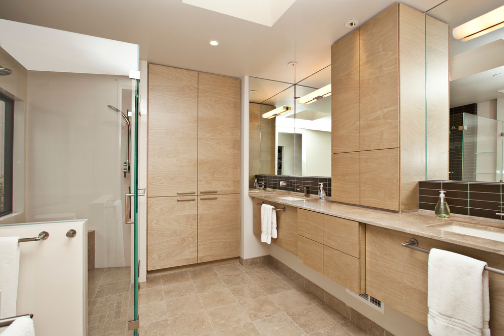 Photo of a modern bathroom in San Francisco with light wood cabinets.