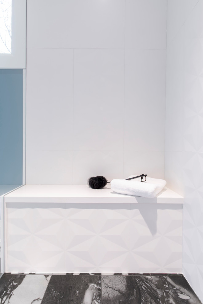 Inspiration for a large contemporary kids bathroom in Toronto with flat-panel cabinets, blue cabinets, a drop-in tub, an alcove shower, a wall-mount toilet, white tile, porcelain tile, white walls, porcelain floors, an undermount sink, engineered quartz benchtops, white floor, a hinged shower door and white benchtops.