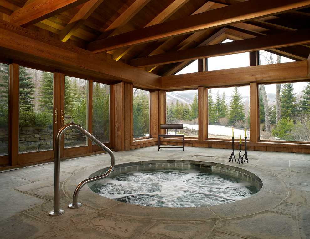 Inspiration for an arts and crafts indoor round pool in Burlington with a hot tub.
