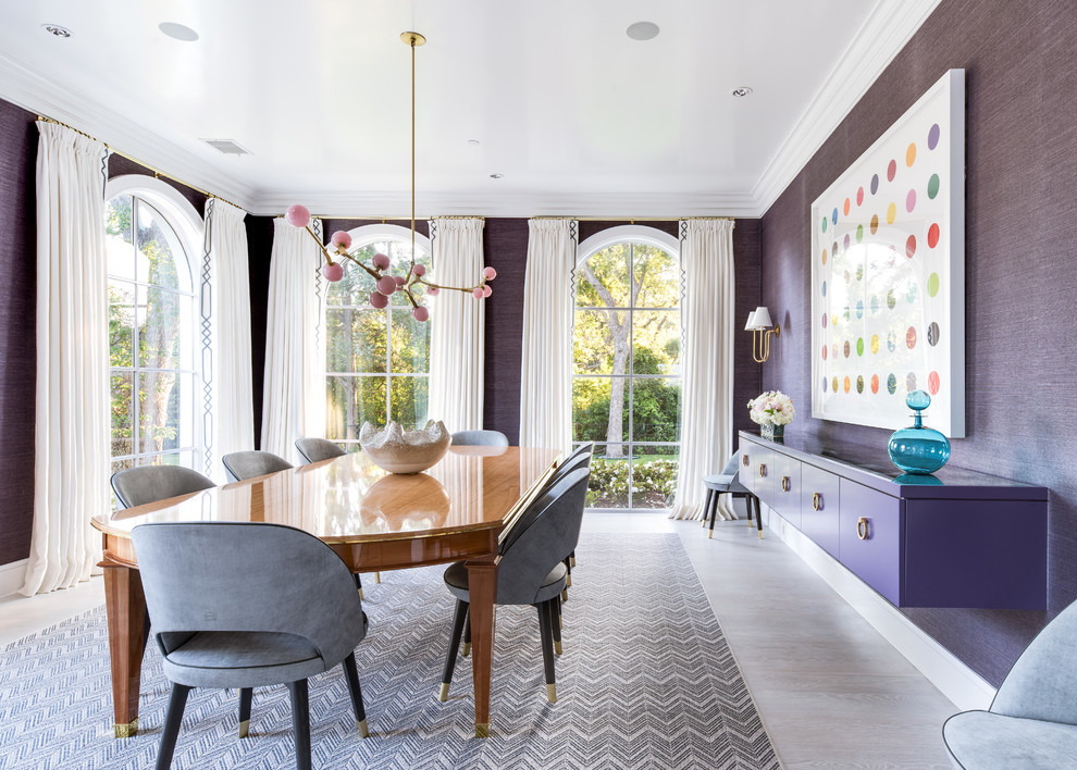 Inspiration for a transitional separate dining room in Dallas with purple walls and grey floor.