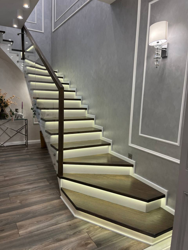 Inspiration for a contemporary concrete l-shaped staircase in Moscow with concrete risers and mixed railing.