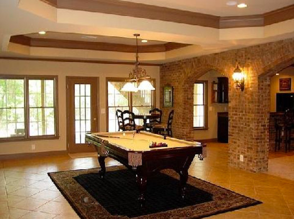 This is an example of a mid-sized basement in Baltimore with beige walls and ceramic floors.