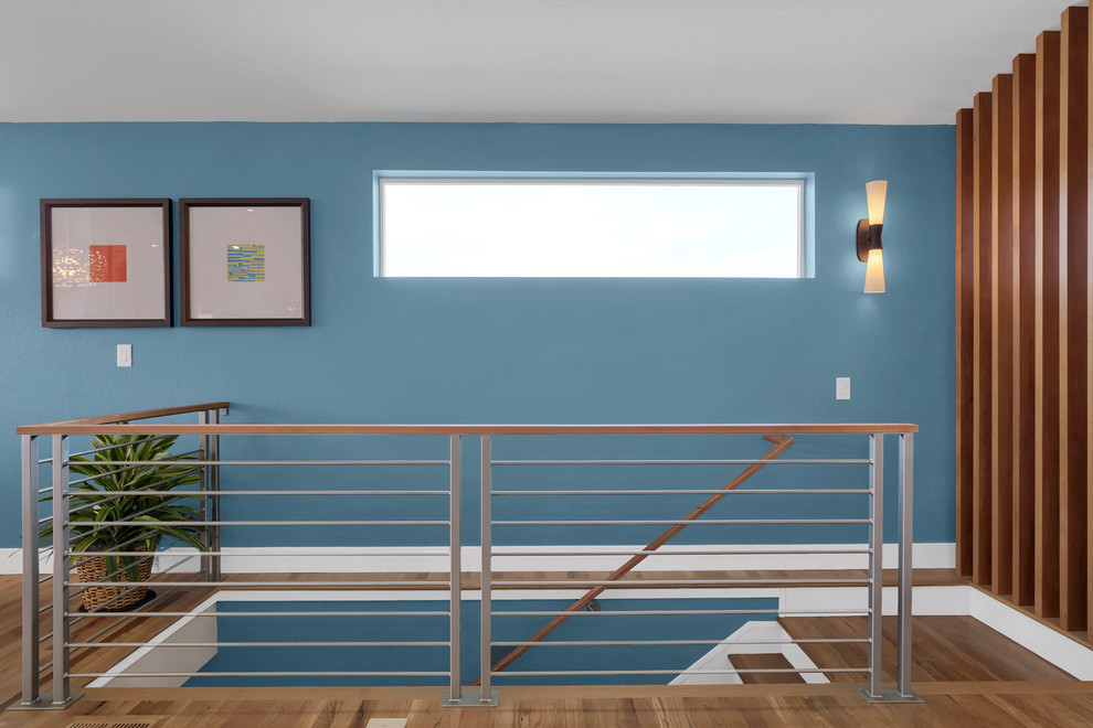 Photo of a contemporary wood straight staircase in Denver with wood risers and mixed railing.