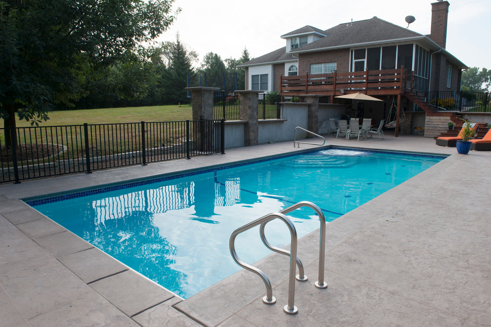 This is an example of a mid-sized contemporary pool in Cedar Rapids.