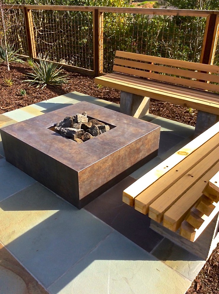 Design ideas for a mid-sized modern backyard full sun garden in San Francisco with a fire feature and natural stone pavers.