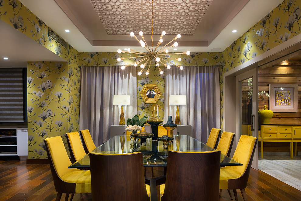 Photo of a transitional dining room in Other with yellow walls, dark hardwood floors and brown floor.
