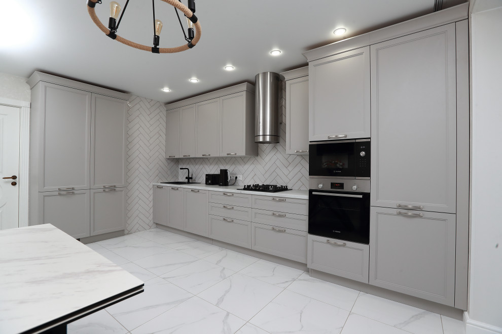 Design ideas for a large transitional l-shaped open plan kitchen in Moscow with recessed-panel cabinets, grey cabinets, solid surface benchtops, white splashback, subway tile splashback, no island and white benchtop.