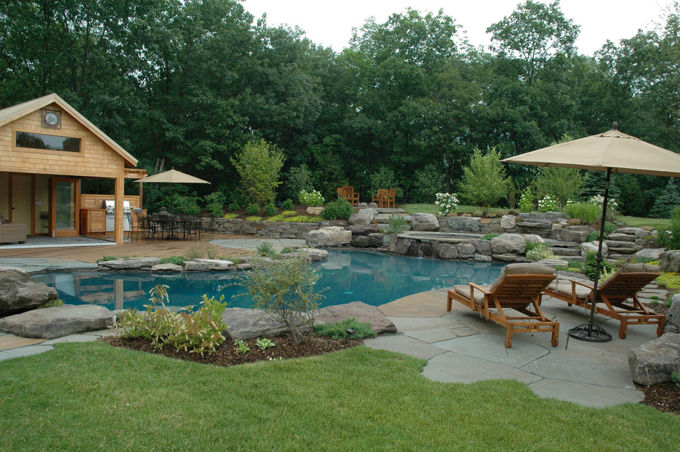 Design ideas for a traditional custom-shaped natural pool in New York.