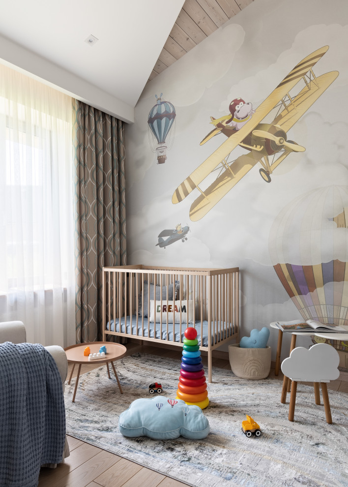 This is an example of a medium sized contemporary toddler’s room in Saint Petersburg with beige walls, medium hardwood flooring, brown floors and a wood ceiling.