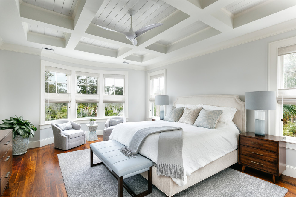 Design ideas for a transitional bedroom in Charleston with grey walls, medium hardwood floors and brown floor.