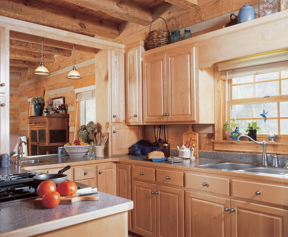 Inspiration for a mid-sized rustic eat-in kitchen remodel with a double-bowl sink, raised-panel cabinets, light wood cabinets, laminate countertops, brown backsplash, wood backsplash and stainless steel appliances
