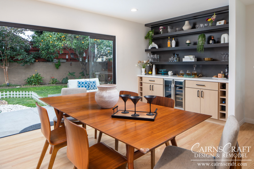 Eat-in kitchen - large modern l-shaped medium tone wood floor, beige floor and exposed beam eat-in kitchen idea in San Diego with an undermount sink, flat-panel cabinets, distressed cabinets, quartzite countertops, white backsplash, stone slab backsplash, stainless steel appliances, an island and white countertops