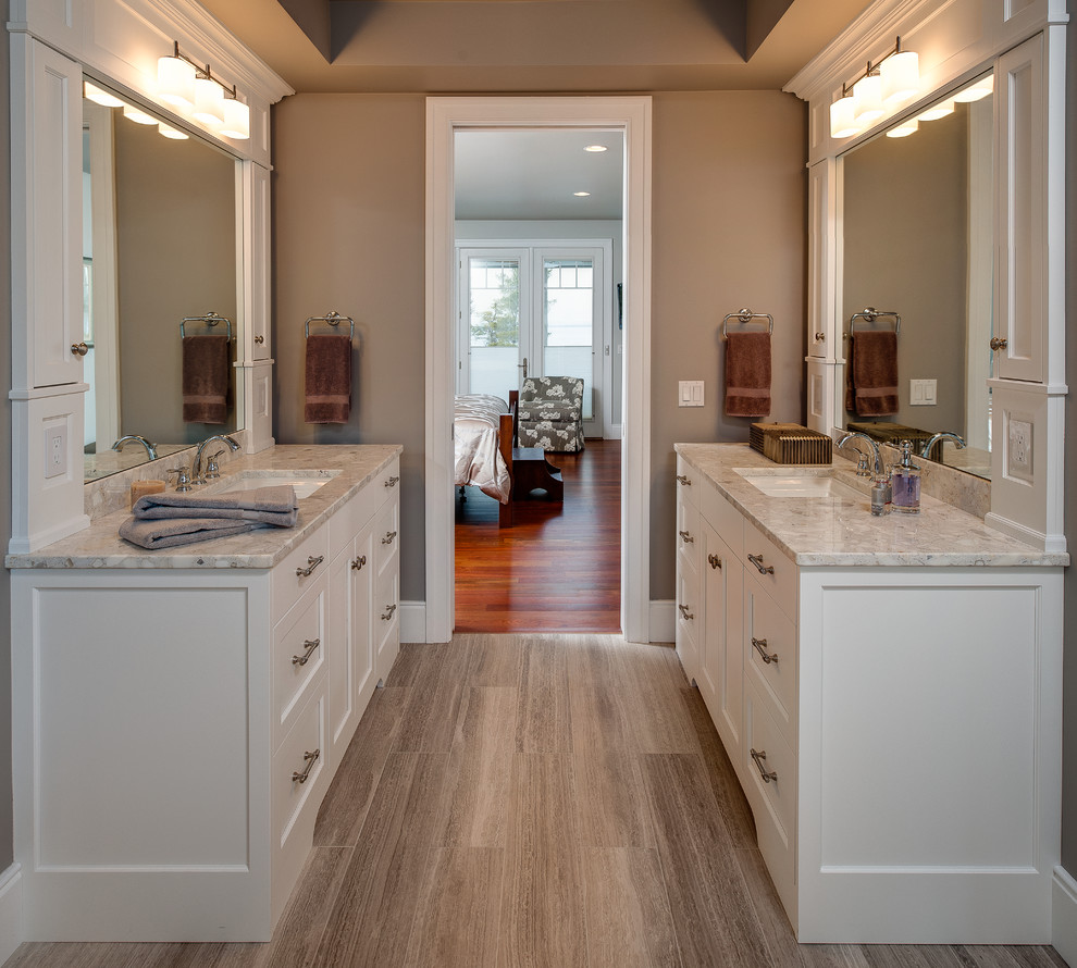 Large transitional master bathroom in Other with an undermount sink, recessed-panel cabinets, white cabinets, granite benchtops, a freestanding tub, an open shower, a one-piece toilet, ceramic tile, grey walls and ceramic floors.