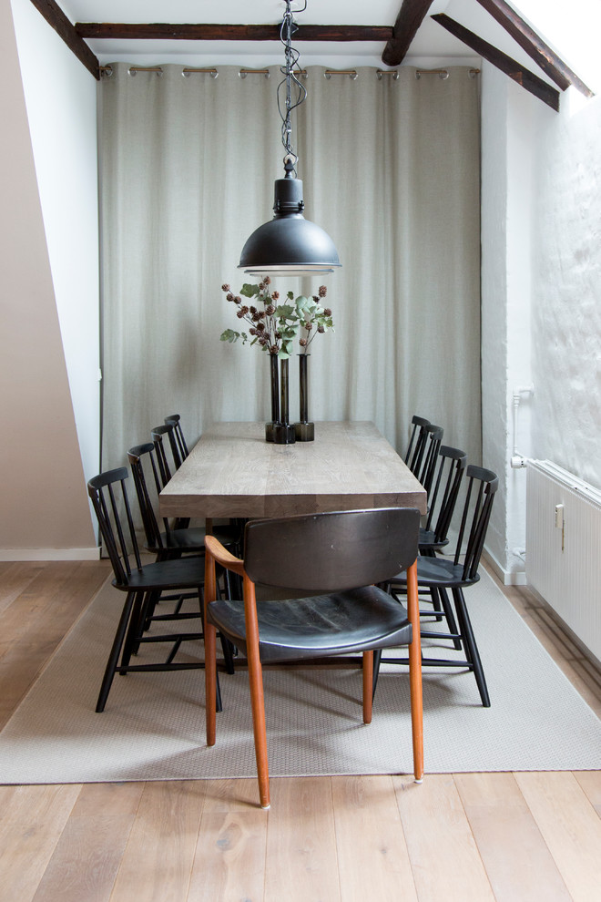 Enclosed dining room - mid-sized scandinavian light wood floor enclosed dining room idea in Copenhagen with white walls and no fireplace