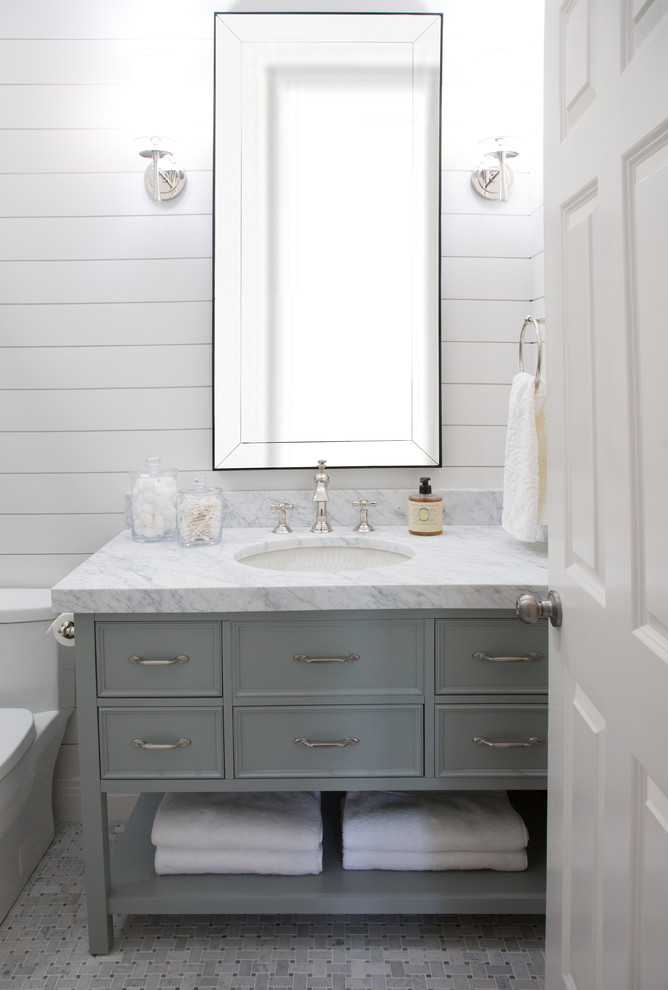 Inspiration for a small transitional 3/4 marble tile and gray tile mosaic tile floor and gray floor bathroom remodel in Austin with a one-piece toilet, white walls, an undermount sink, marble countertops, furniture-like cabinets and gray cabinets