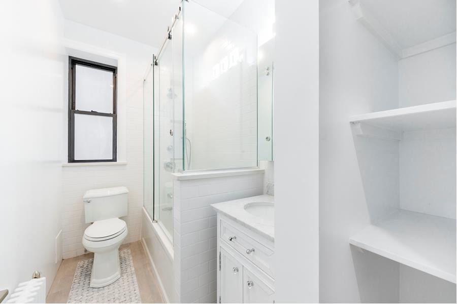 Inspiration for a small transitional master bathroom in New York with shaker cabinets and a freestanding vanity.