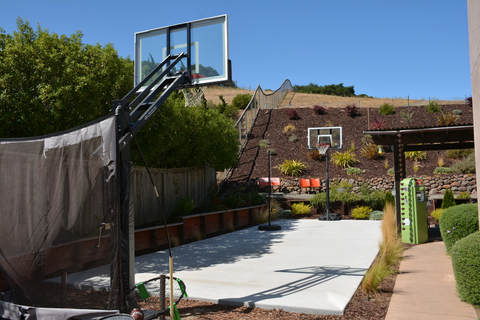 Design ideas for a large mediterranean backyard full sun outdoor sport court in San Francisco with with outdoor playset and concrete pavers.