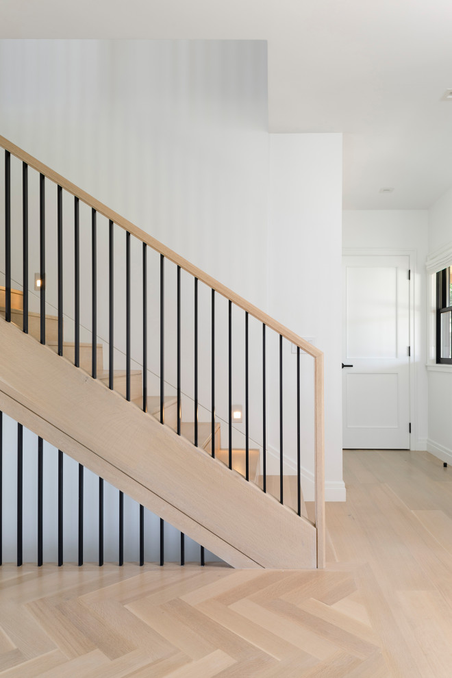 Inspiration for a beach style wood straight staircase in Boston with wood risers and mixed railing.