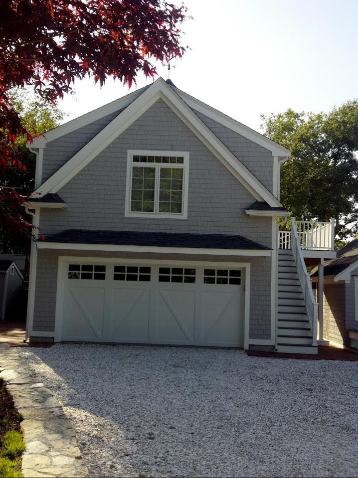 This is an example of a mid-sized traditional garage in Boston.