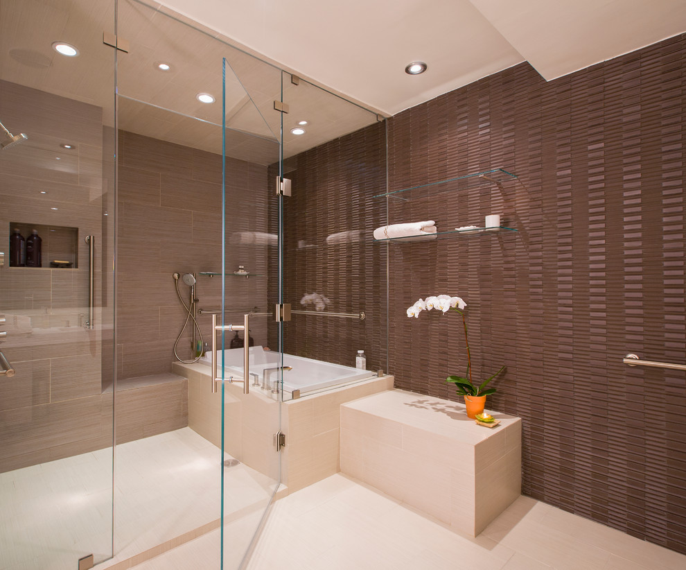 Large transitional master brown tile and porcelain tile porcelain tile drop-in bathtub photo in DC Metro with brown walls, an undermount sink, flat-panel cabinets, light wood cabinets, quartz countertops and a one-piece toilet
