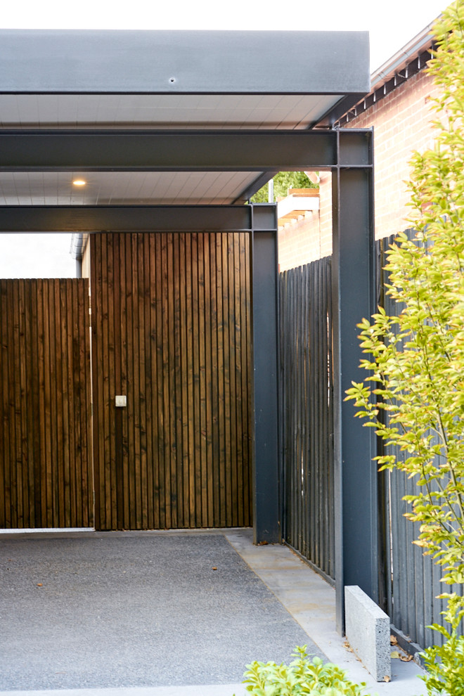 Inspiration for a large contemporary detached two-car carport in Melbourne.