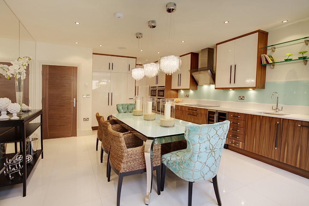 This is an example of a large transitional single-wall eat-in kitchen in Other with an undermount sink, flat-panel cabinets, dark wood cabinets, blue splashback, stainless steel appliances, no island, solid surface benchtops, glass sheet splashback and porcelain floors.