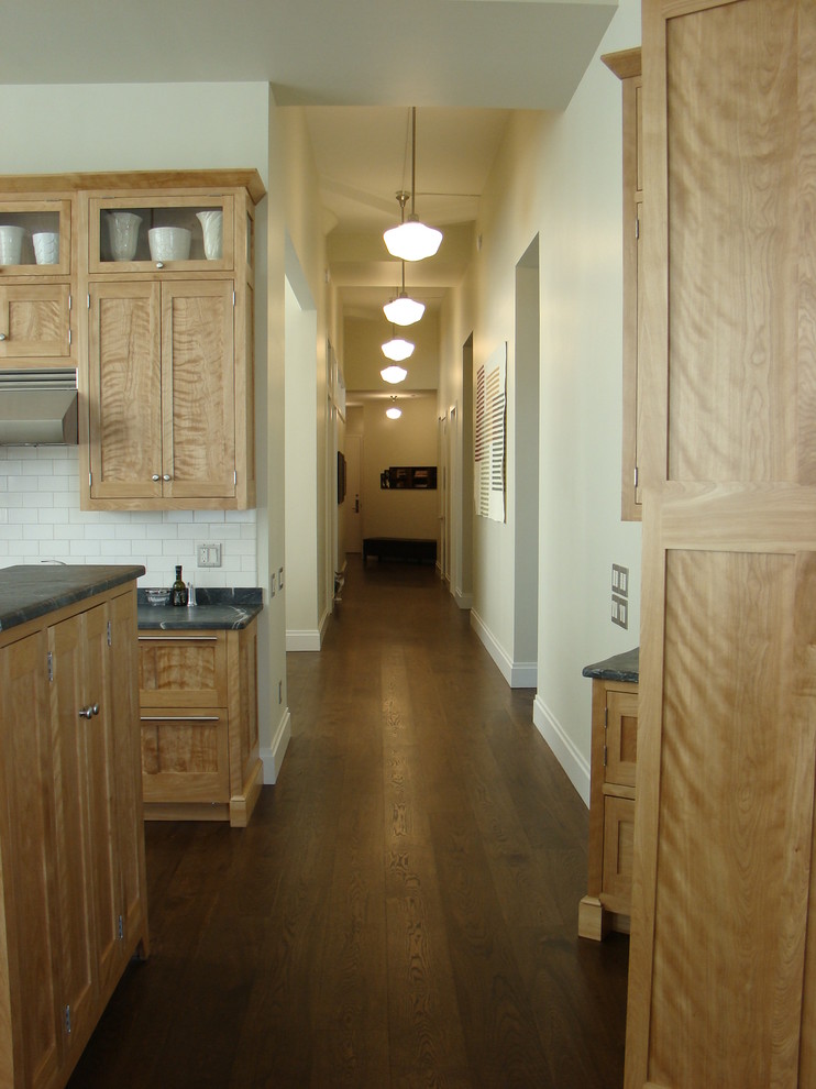 Design ideas for a mid-sized traditional hallway in Portland Maine with white walls and dark hardwood floors.
