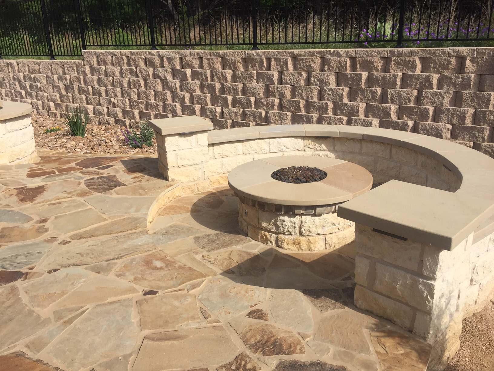 Flagstone patio w/ sunken gas fire pit and seating area