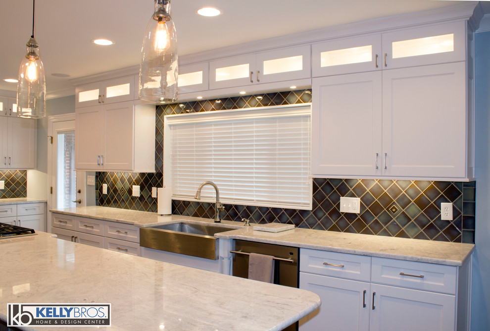 Example of a large transitional medium tone wood floor eat-in kitchen design in Cincinnati with a farmhouse sink, flat-panel cabinets, white cabinets, granite countertops, blue backsplash, ceramic backsplash, stainless steel appliances and an island