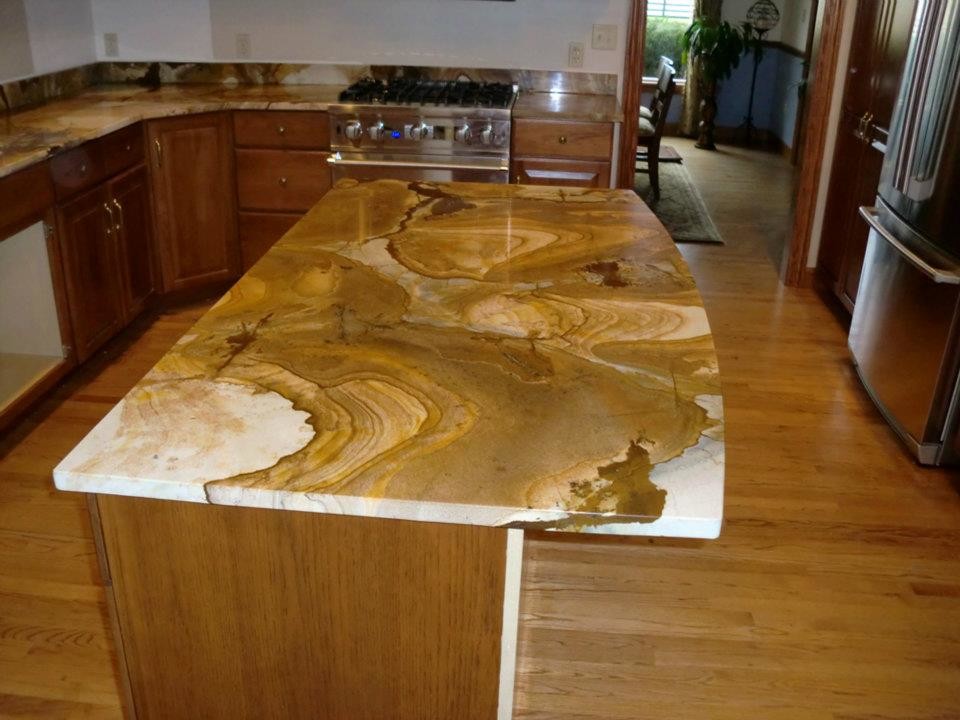 Inspiration for a transitional light wood floor kitchen remodel in Chicago with medium tone wood cabinets, marble countertops, stainless steel appliances and an island