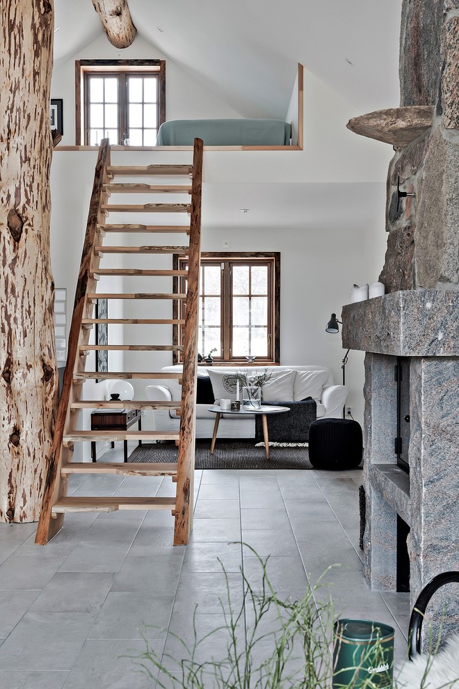 Photo of a mid-sized country wood straight staircase in Malmo with open risers.
