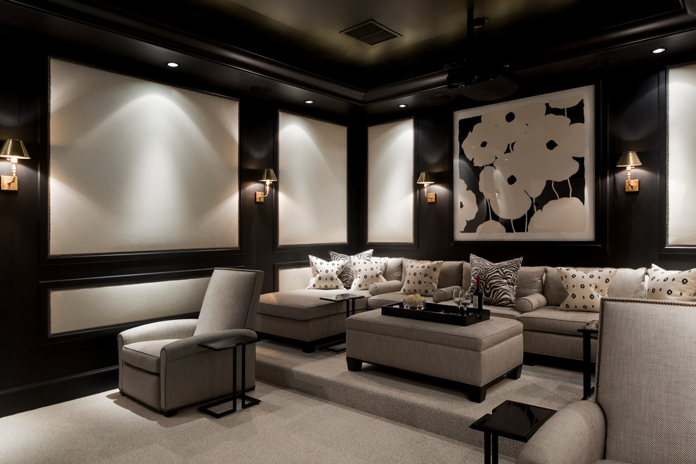 This is an example of a large traditional enclosed home theatre in Miami with grey floor, black walls, carpet and a projector screen.
