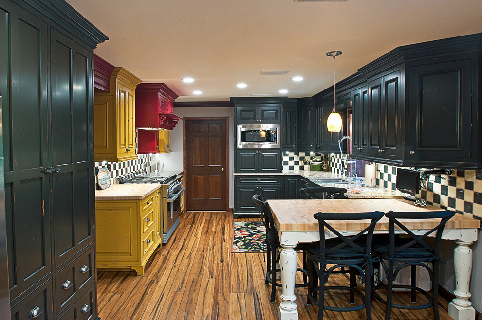Photo of a country eat-in kitchen in Other with a farmhouse sink, beaded inset cabinets, blue cabinets, marble benchtops and stainless steel appliances.