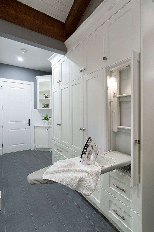 Transitional laundry room photo in Vancouver