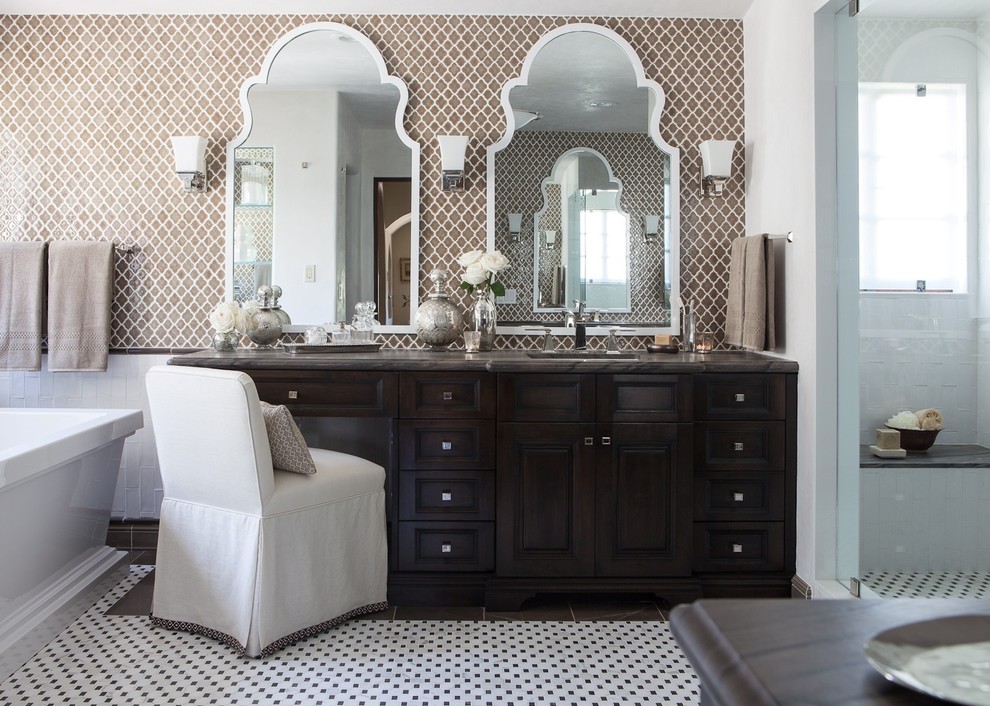 Freestanding bathtub - mid-sized transitional master brown tile and ceramic tile mosaic tile floor freestanding bathtub idea in Los Angeles with raised-panel cabinets, dark wood cabinets and brown walls