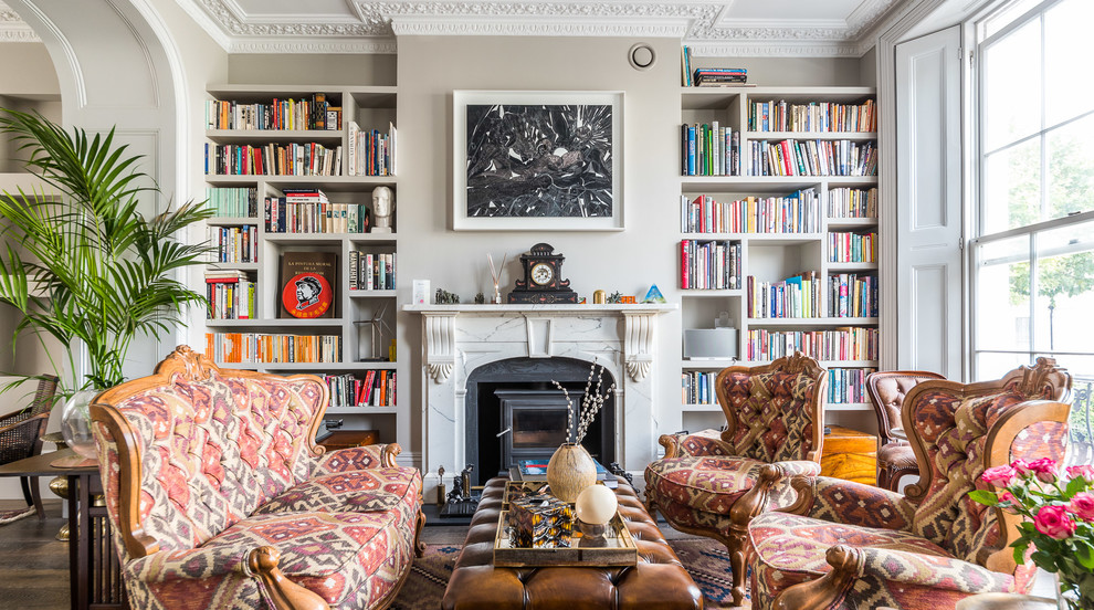 This is an example of a mid-sized eclectic enclosed living room in London with grey walls.