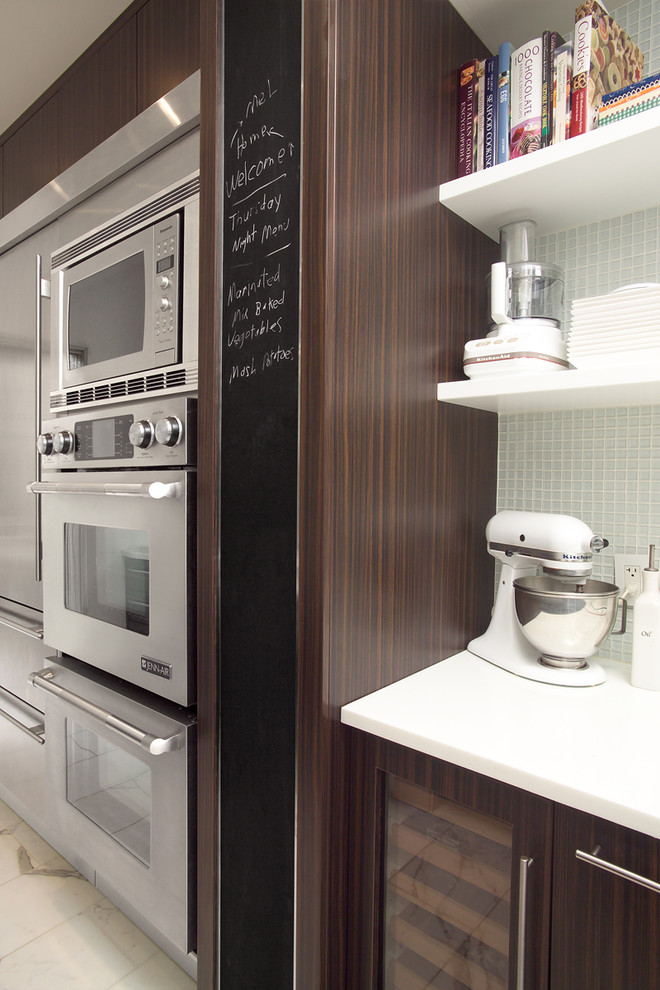 This is an example of a contemporary kitchen in Toronto with stainless steel appliances.