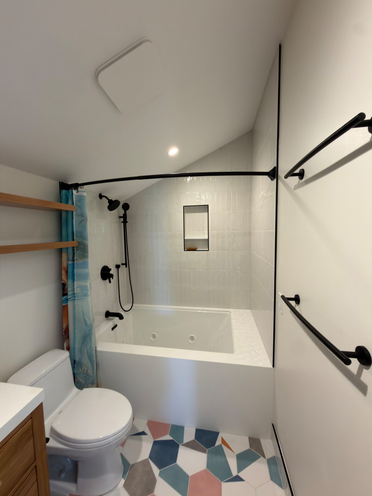 White Tub-Shower Bathroom with Geometric Colorful Floor Tile