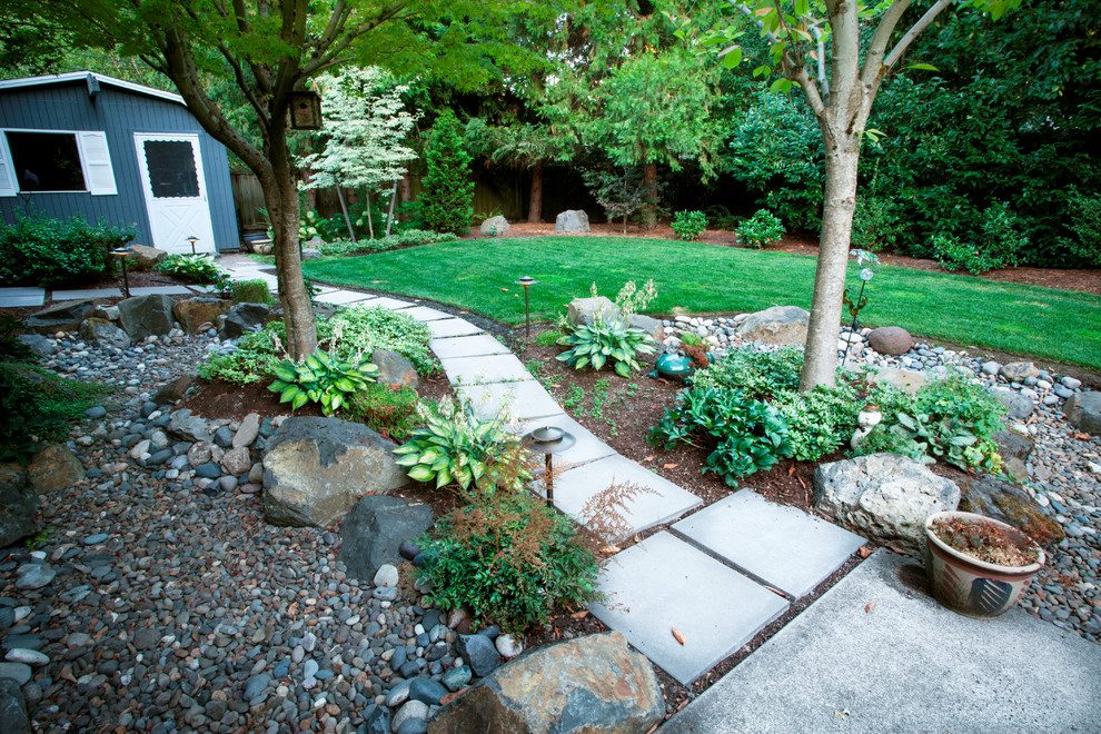 Mid-sized midcentury backyard full sun garden in Portland with a garden path and concrete pavers for summer.