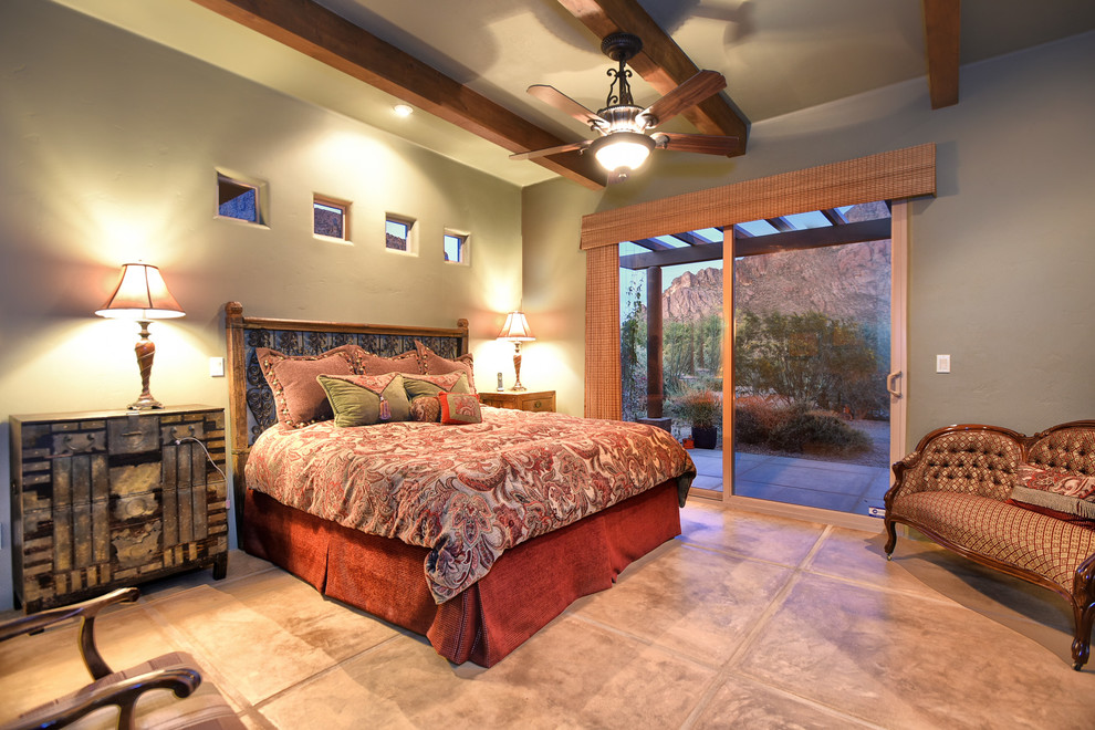 Design ideas for a mid-sized master bedroom in Phoenix with beige walls, terra-cotta floors and no fireplace.