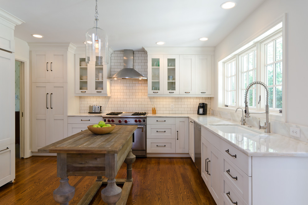 Photo of a traditional kitchen in Richmond with an undermount sink, shaker cabinets, white cabinets, white splashback and subway tile splashback.