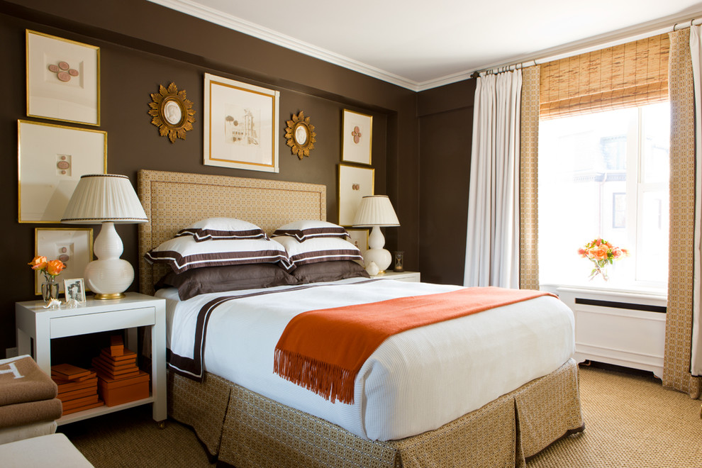 Photo of a traditional master bedroom in Boston with brown walls and carpet.
