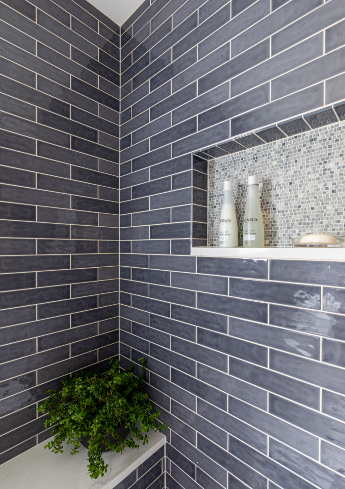 Example of a small transitional 3/4 blue tile and ceramic tile mosaic tile floor, white floor, single-sink and wallpaper alcove shower design in Chicago with flat-panel cabinets, gray cabinets, a one-piece toilet, blue walls, an undermount sink, quartz countertops, a hinged shower door, white countertops and a floating vanity