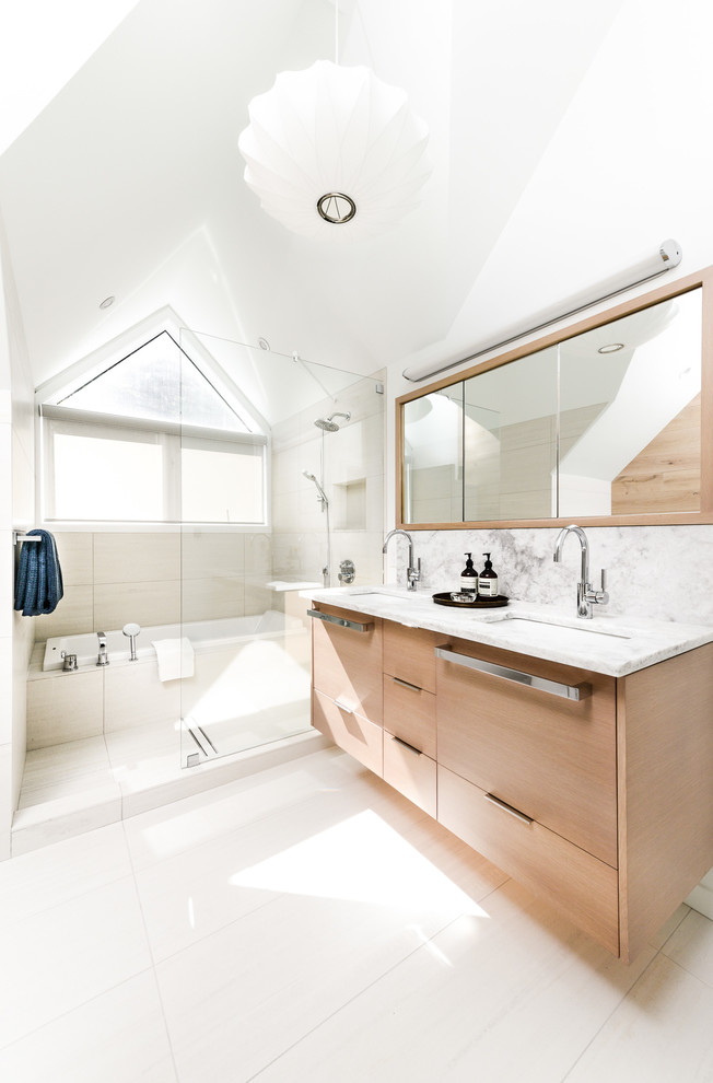 Inspiration for a mid-sized contemporary master bathroom in Vancouver with an undermount sink, flat-panel cabinets, light wood cabinets, stone slab, a drop-in tub, an open shower, green tile, marble benchtops, white walls and an open shower.
