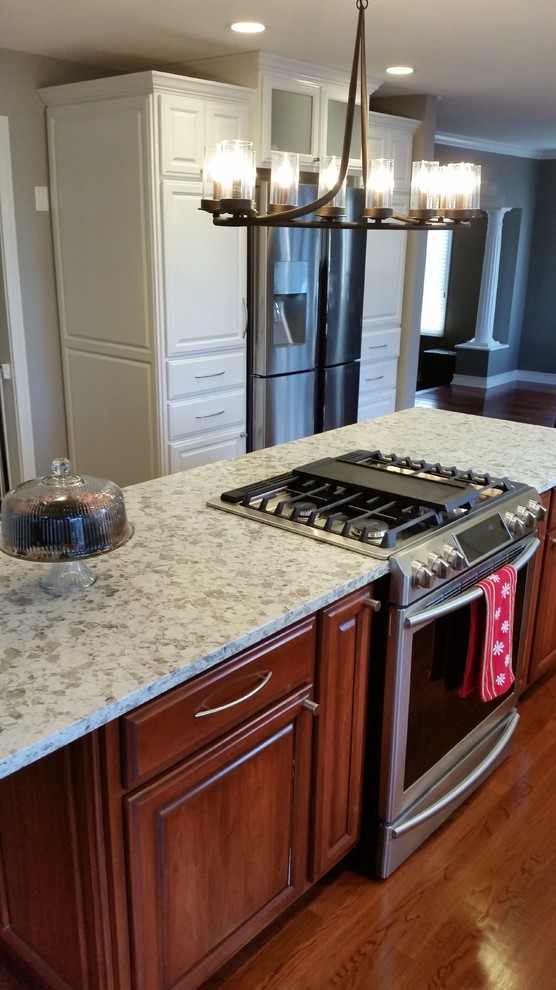 Transitional kitchen photo with an island